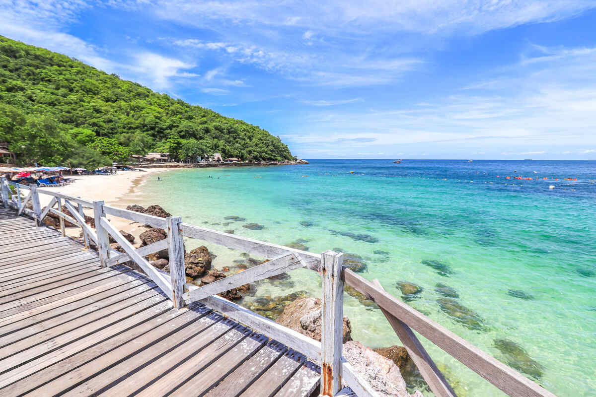 White sandy pathway with a tropical seascape. Sangwan Beach in Koh Larn