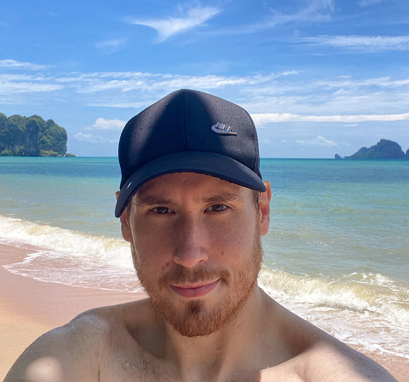 man taking a selfie on a southern Thai beach